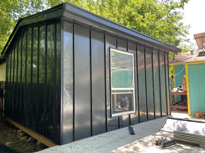 Black standing seam metal wall panels for Roof Inspection in Reedurban